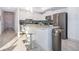 Bright kitchen featuring stainless steel appliances and an island at 3191 Paradox Cir # 406, Kissimmee, FL 34746
