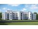 Modern apartment building with light gray facade at 3191 Paradox Cir # 406, Kissimmee, FL 34746