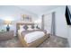 Spacious bedroom with king-size bed, neutral decor, and large window at 3191 Paradox Cir # 406, Kissimmee, FL 34746