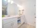 Clean bathroom with double vanity, bright lighting, and neutral decor at 3191 Paradox Cir # 406, Kissimmee, FL 34746