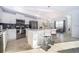 Modern kitchen with stainless steel appliances and an island at 3191 Paradox Cir # 406, Kissimmee, FL 34746