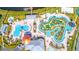 An aerial view of a community pool area with a lazy river and a water slide at 3191 Paradox Cir # 406, Kissimmee, FL 34746