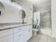 Bathroom with double vanity, granite countertop, and shower/tub combo at 2809 Almaton Loop # 304, Kissimmee, FL 34747