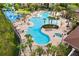Resort-style pool with lounge chairs and hot tub at 2809 Almaton Loop # 304, Kissimmee, FL 34747