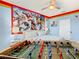 Bedroom with foosball table and large Marvel mural at 2809 Almaton Loop # 304, Kissimmee, FL 34747