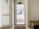 Welcoming entryway with a Disney-themed rug and artwork at 2809 Almaton Loop # 304, Kissimmee, FL 34747