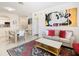 Living room with sofa and coffee table, adjacent to the dining area at 2809 Almaton Loop # 304, Kissimmee, FL 34747