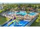 Resort-style pool with water features, a playground, and lounge chairs at 2809 Almaton Loop # 304, Kissimmee, FL 34747