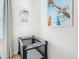 Bedroom with travel crib and beach-themed wall art at 2809 Almaton Loop # 304, Kissimmee, FL 34747