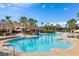 Relaxing resort-style pool with lounge chairs and palm trees at 2809 Almaton Loop # 304, Kissimmee, FL 34747