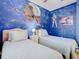 Star Wars themed bedroom with twin beds and a Death Star mural at 2809 Almaton Loop # 304, Kissimmee, FL 34747