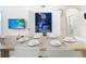 Dining area with a wood table and white chairs, next to a themed bedroom at 2809 Almaton Loop # 304, Kissimmee, FL 34747