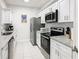 Modern kitchen with stainless steel appliances and granite countertops at 2809 Almaton Loop # 304, Kissimmee, FL 34747