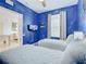 Star Wars themed bedroom with twin beds, wall mural, and access to another room at 2809 Almaton Loop # 304, Kissimmee, FL 34747