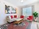 Living room with a comfy sofa, red armchairs, and a coffee table at 2809 Almaton Loop # 304, Kissimmee, FL 34747