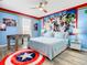 King size bedroom with Marvel themed wall art and foosball table at 2809 Almaton Loop # 304, Kissimmee, FL 34747