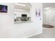 Kitchen with granite countertop and pass-through to living room at 2809 Almaton Loop # 304, Kissimmee, FL 34747