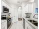 Modern kitchen with stainless steel appliances and granite countertops at 2809 Almaton Loop # 304, Kissimmee, FL 34747