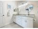 Double vanity bathroom with granite countertops at 2809 Almaton Loop # 304, Kissimmee, FL 34747