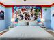King bedroom with Marvel character wall mural and foosball table at 2809 Almaton Loop # 304, Kissimmee, FL 34747