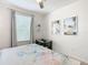 Bright bedroom with a queen bed, beach-themed art, and a changing table at 2809 Almaton Loop # 304, Kissimmee, FL 34747