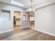 Dining room with kitchen access and modern chandelier at 850 Land Ave, Longwood, FL 32750