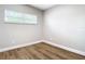 Well-lit bedroom with neutral walls and laminate flooring at 850 Land Ave, Longwood, FL 32750