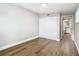 Bedroom with wood-look floors, double door closet and a view of the bathroom at 850 Land Ave, Longwood, FL 32750