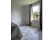 Bright bedroom with marble floor and window at 20 E Wallace St, Orlando, FL 32809