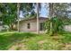 Private backyard with grassy area and patio at 217 Winding Cove Ave, Apopka, FL 32703