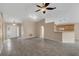 Open living area with a high ceiling, tiled floor, and neutral color palette at 217 Winding Cove Ave, Apopka, FL 32703