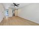 Main bedroom with sliding barn door and hardwood floors at 2445 Sanford Ave, Sanford, FL 32771