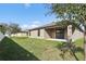 Home exterior view with grassy backyard at 279 Fig Ct, Poinciana, FL 34759