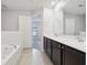 Double vanity bathroom with a soaking tub and separate shower at 279 Fig Ct, Poinciana, FL 34759