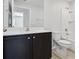 Clean bathroom with dark vanity and bathtub at 279 Fig Ct, Poinciana, FL 34759