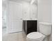 Simple bathroom with toilet and dark vanity at 279 Fig Ct, Poinciana, FL 34759