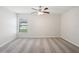 Well-lit bedroom with carpeted floors and a large window at 279 Fig Ct, Poinciana, FL 34759