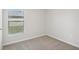 Bedroom with window, carpet, and neutral walls at 279 Fig Ct, Poinciana, FL 34759