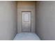 Exterior front door entry to the house at 279 Fig Ct, Poinciana, FL 34759