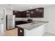 Modern kitchen with stainless steel appliances and granite countertops at 279 Fig Ct, Poinciana, FL 34759