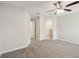 Large main bedroom with carpeted floors and an ensuite bathroom at 279 Fig Ct, Poinciana, FL 34759