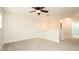 Spacious loft area with ceiling fan and carpeted floor at 759 Lakeview Pointe Dr, Clermont, FL 34711