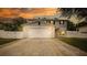 Two-story house with a white double garage door at 759 Lakeview Pointe Dr, Clermont, FL 34711