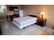 Cozy bedroom with double bed, dresser and kitchenette at 7900 S Orange Blossom Trl # 2053, Orlando, FL 32809