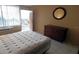 Bright bedroom with a double bed, dresser and balcony access at 7900 S Orange Blossom Trl # 2053, Orlando, FL 32809