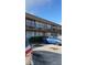 Two-story building with multiple units and ample parking at 7900 S Orange Blossom Trl # 2053, Orlando, FL 32809