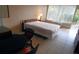 Comfortable bedroom with double bed, dining table and access to balcony at 7900 S Orange Blossom Trl # 2053, Orlando, FL 32809