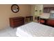 Simple bedroom with double bed, dresser and access to kitchenette at 7900 S Orange Blossom Trl # 2053, Orlando, FL 32809