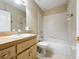 Clean bathroom with a tub, toilet and vanity at 944 Hicks Rd, Lakeland, FL 33813