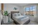 Cozy bedroom with a queen-size bed and large window at 4161 Singing Mockingbird Blvd, Bartow, FL 33830